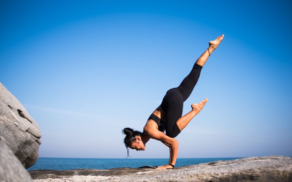 woman doing yoga representing how to work hard without destroying yourself
