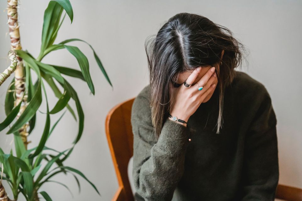 Woman hanging her head in shame