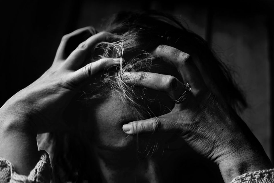 Stressed out woman representing a conspiracy theorist