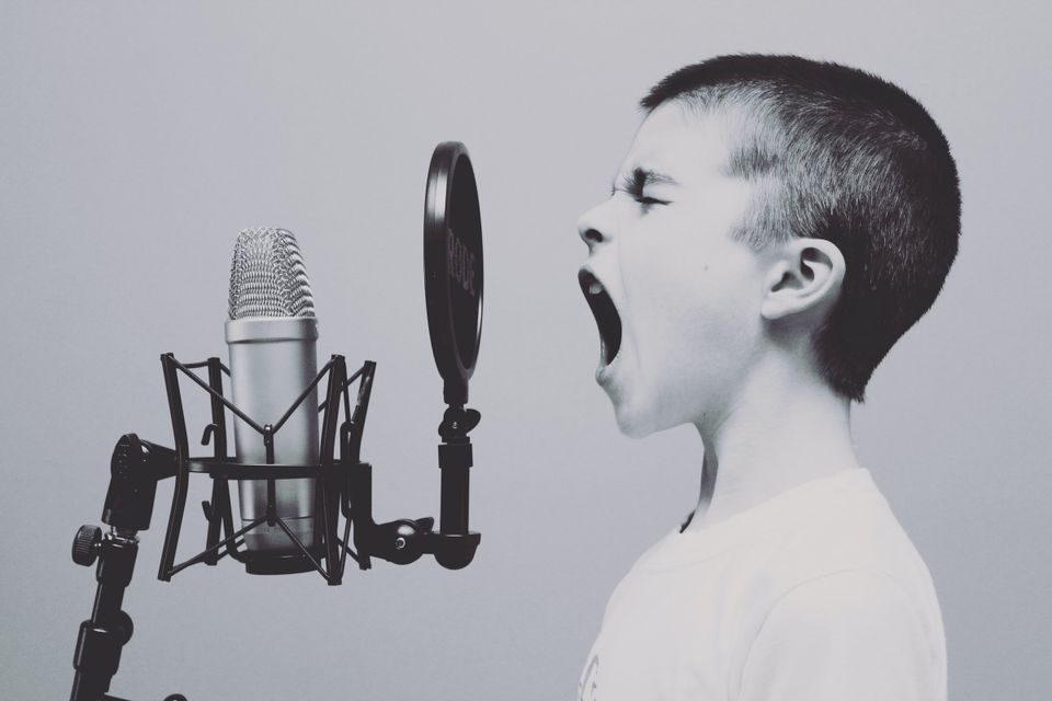 Kid yelling into a mic because no one can hear you talk 
