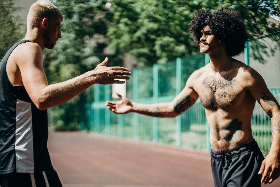 Two men going in for a handshake