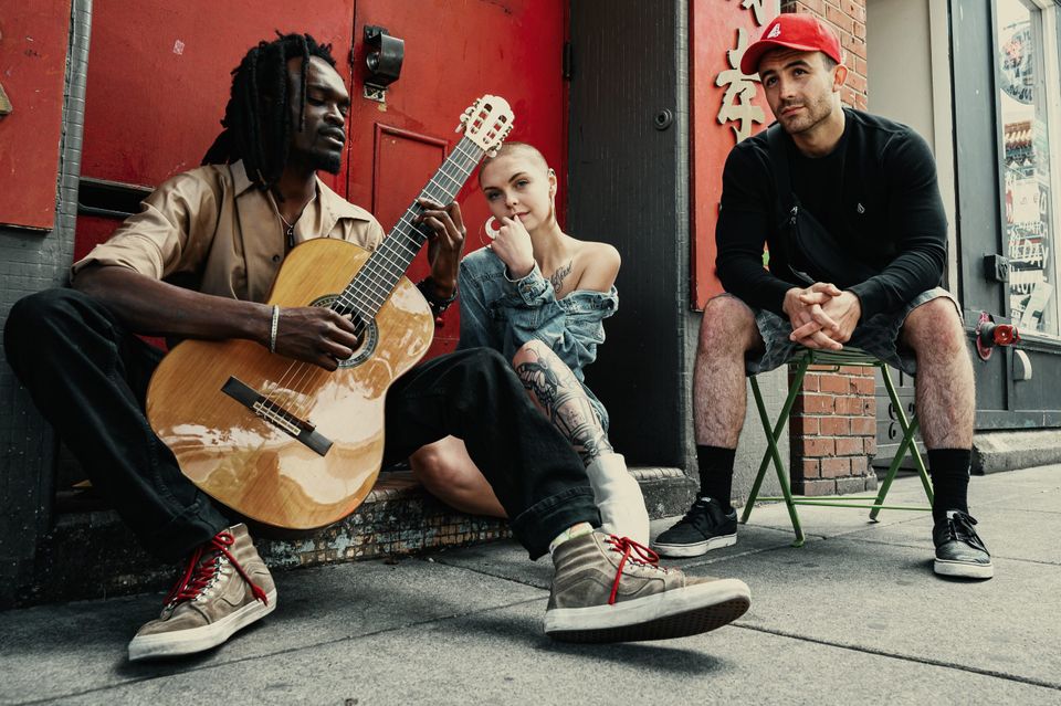 Group of friends hanging out on a curb representing how to connect with other people