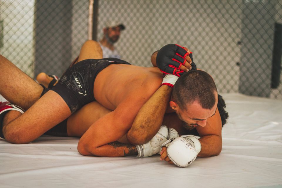 Two MMA fighters doing brazilian jiu jitsu