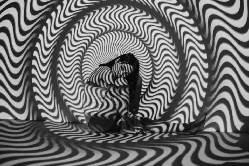 Woman by herself in a trippy photo shoot representing being socially anxious