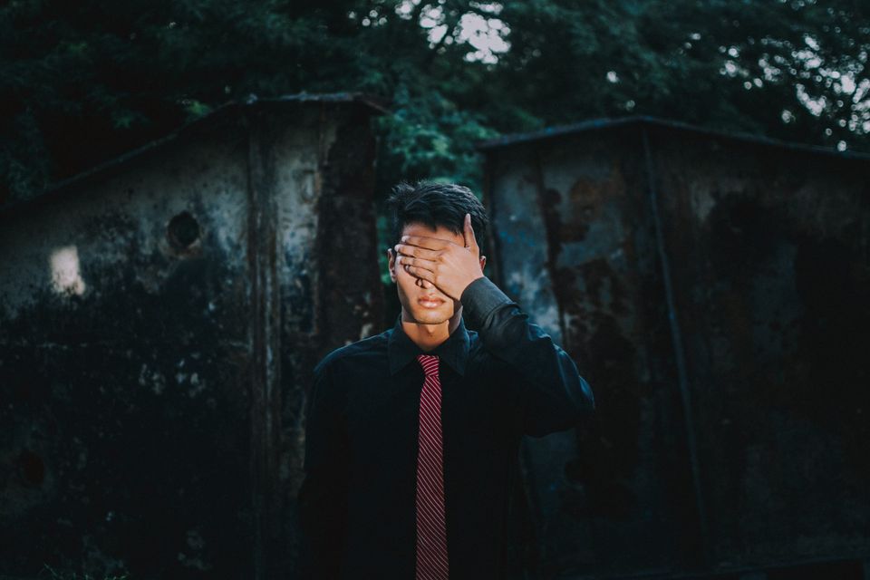 Kid covering his eyes representing people not seeing mental illness