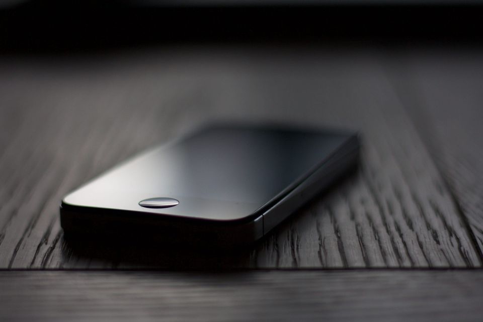 Phone on a table representing media consumption